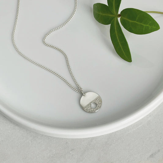 MODERNIST SMALL SILVER CIRCLE HOLE NECKLACE - Genevieve Broughton