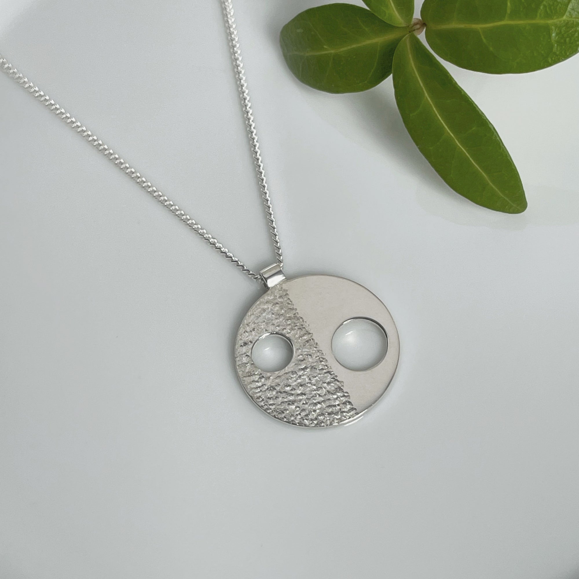 MODERNIST DIVIDED CIRCLE NECKLACE