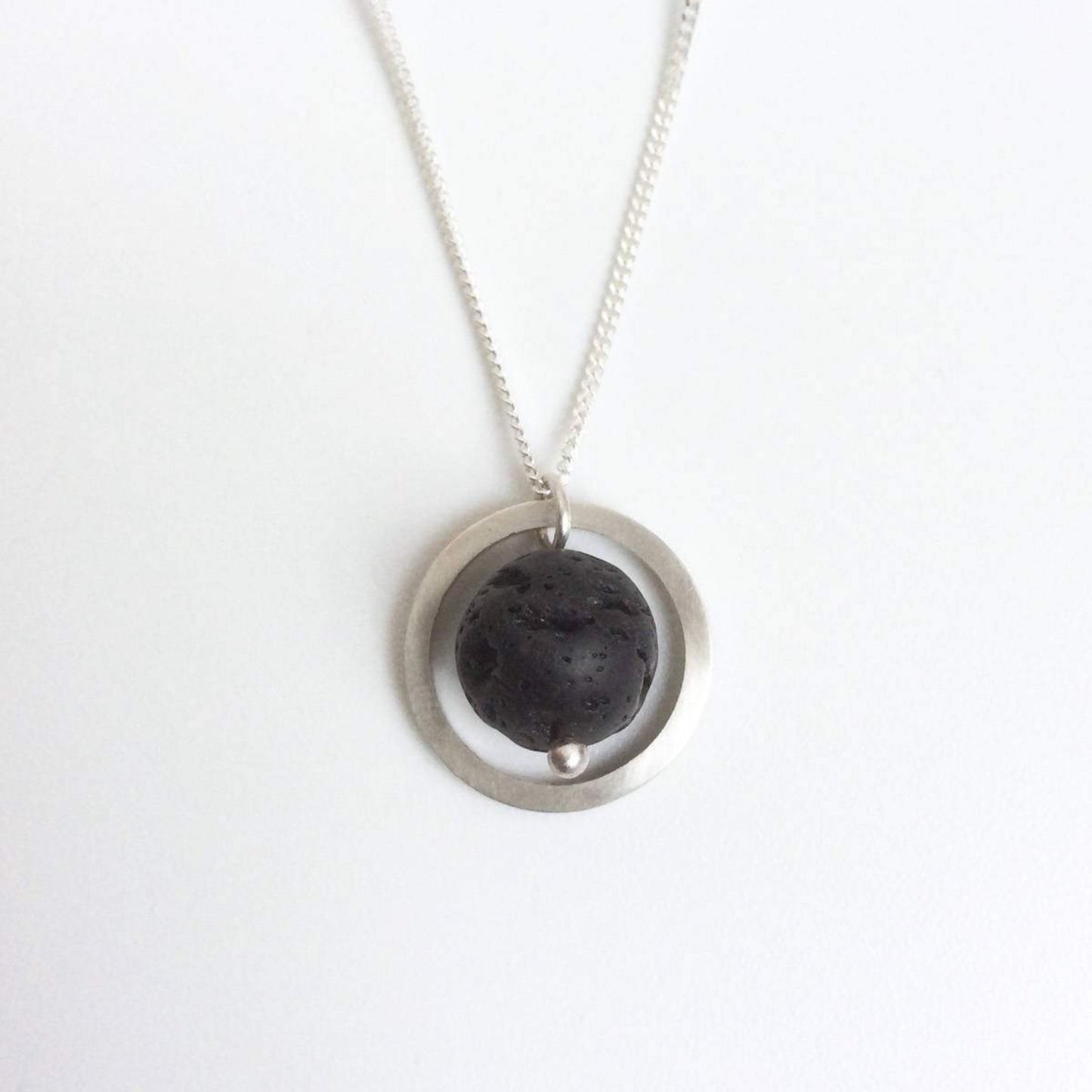 SILVER CIRCLE LAVA STONE DIFFUSER NECKLACE - Genevieve Broughton