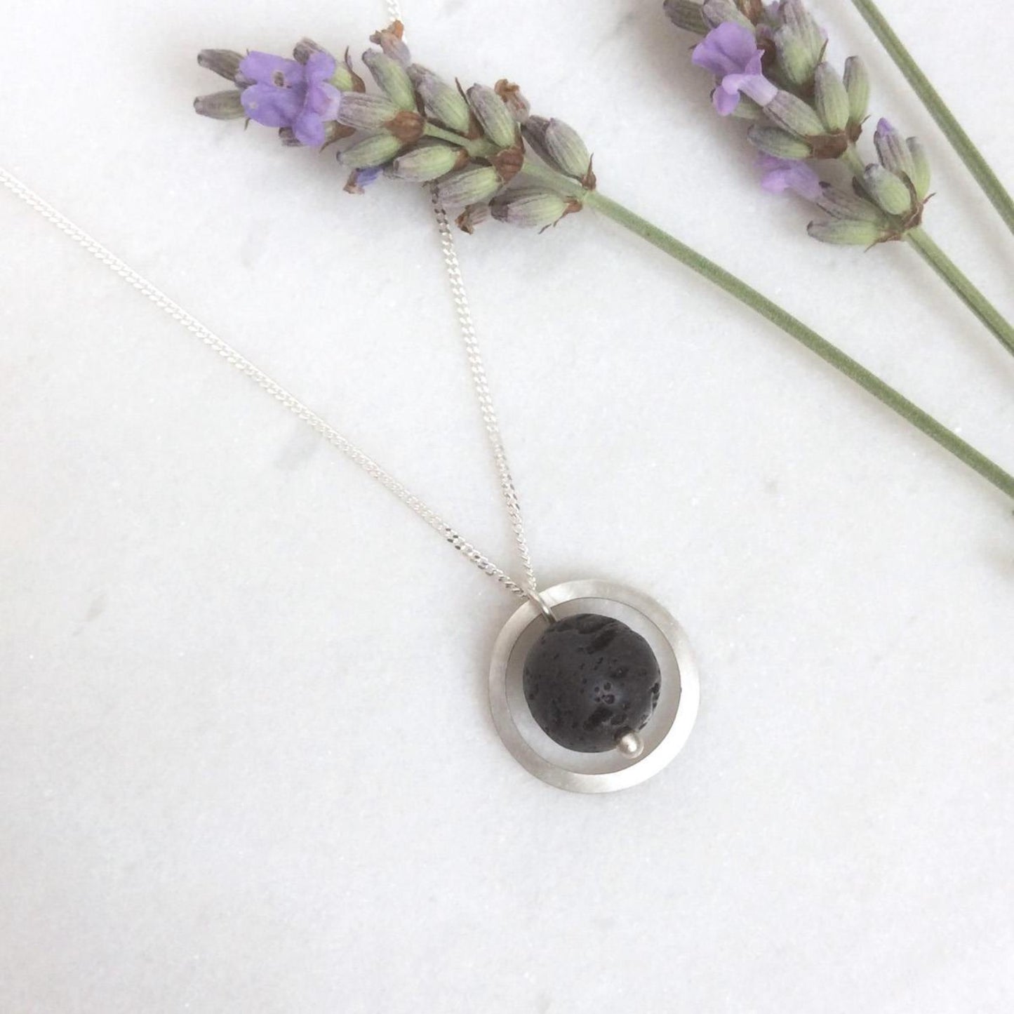 SILVER CIRCLE LAVA STONE DIFFUSER NECKLACE - Genevieve Broughton