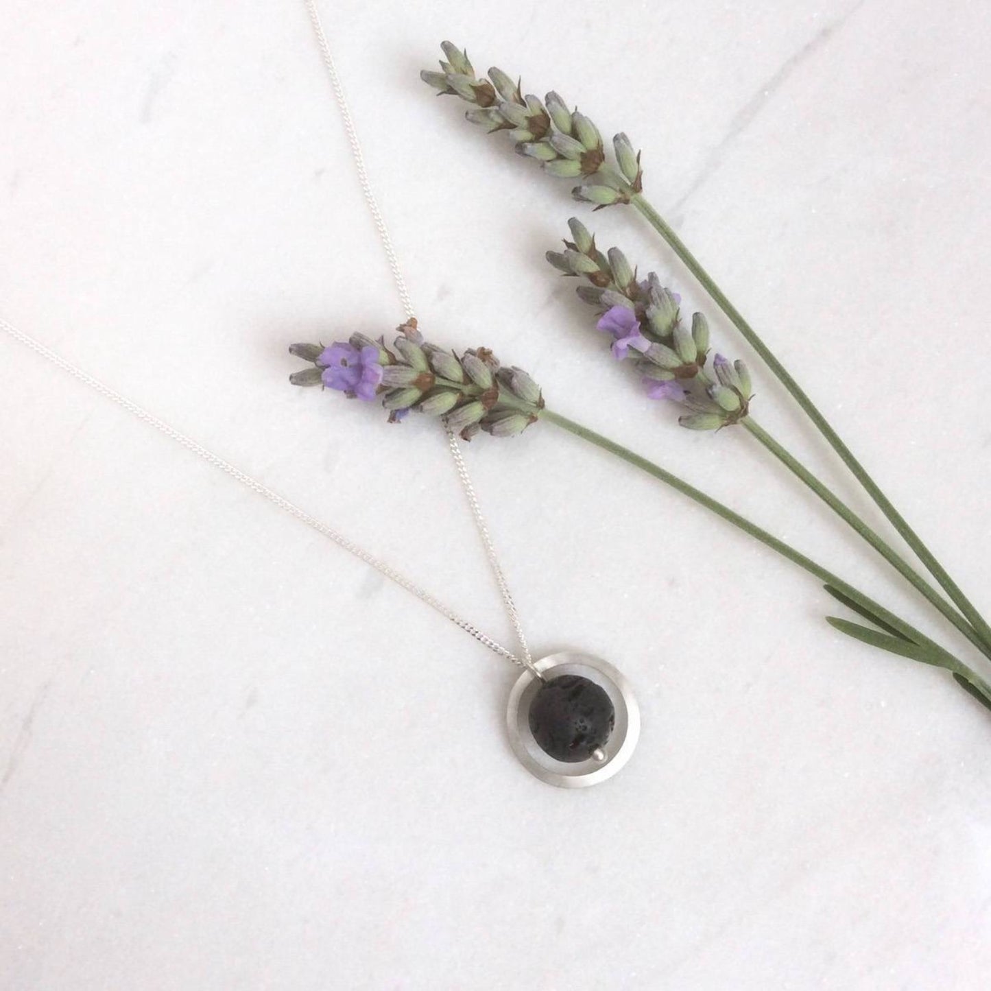 SILVER CIRCLE LAVA STONE DIFFUSER NECKLACE - Genevieve Broughton