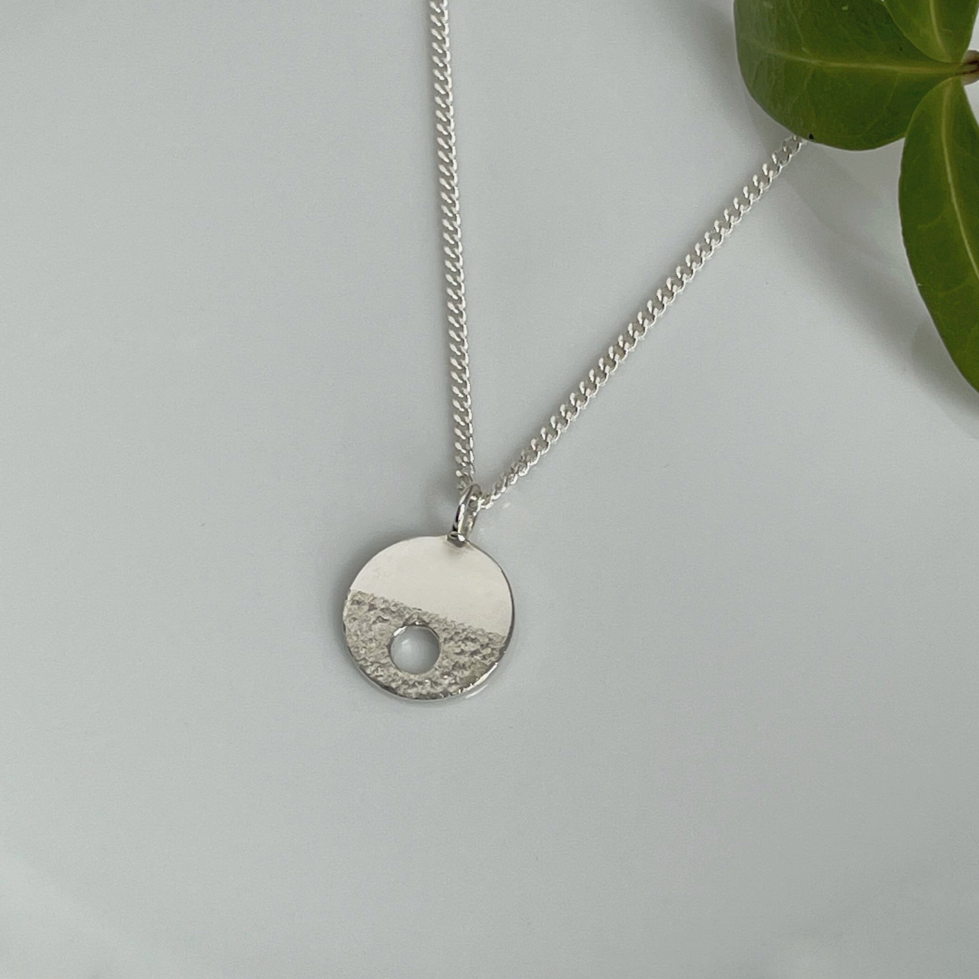 MODERNIST SMALL SILVER CIRCLE HOLE NECKLACE - Genevieve Broughton