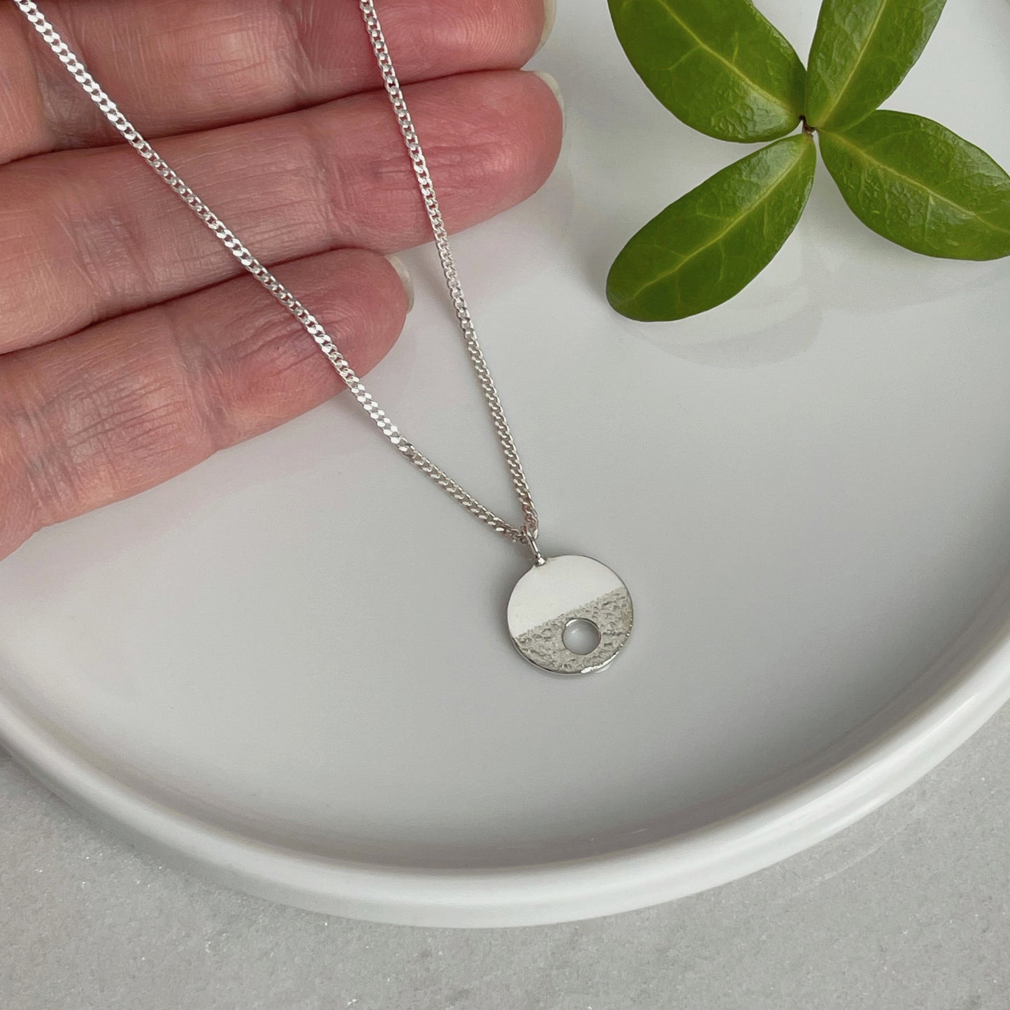 MODERNIST SMALL SILVER CIRCLE HOLE NECKLACE - Genevieve Broughton