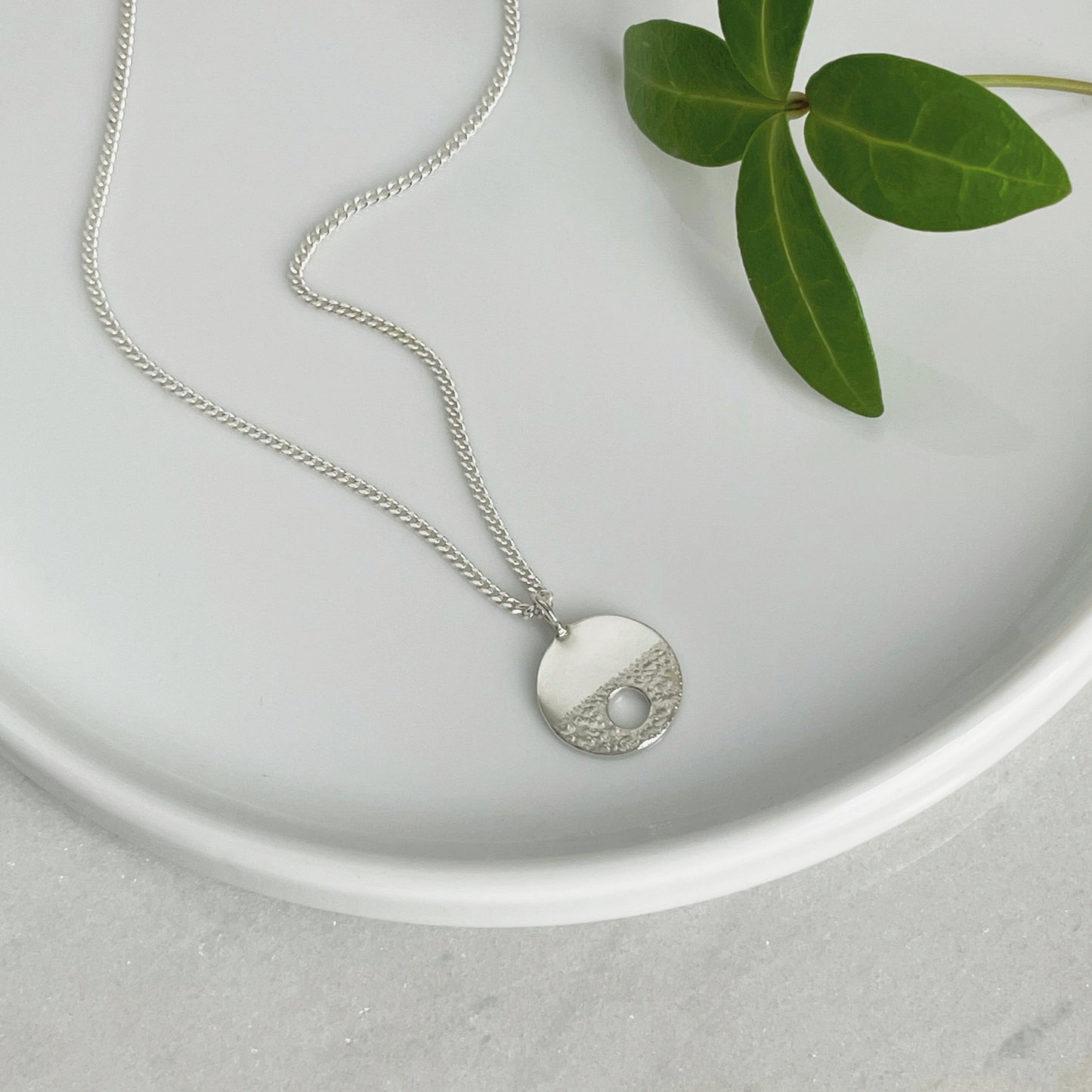 MODERNIST SMALL SILVER CIRCLE HOLE NECKLACE - Genevieve Broughton