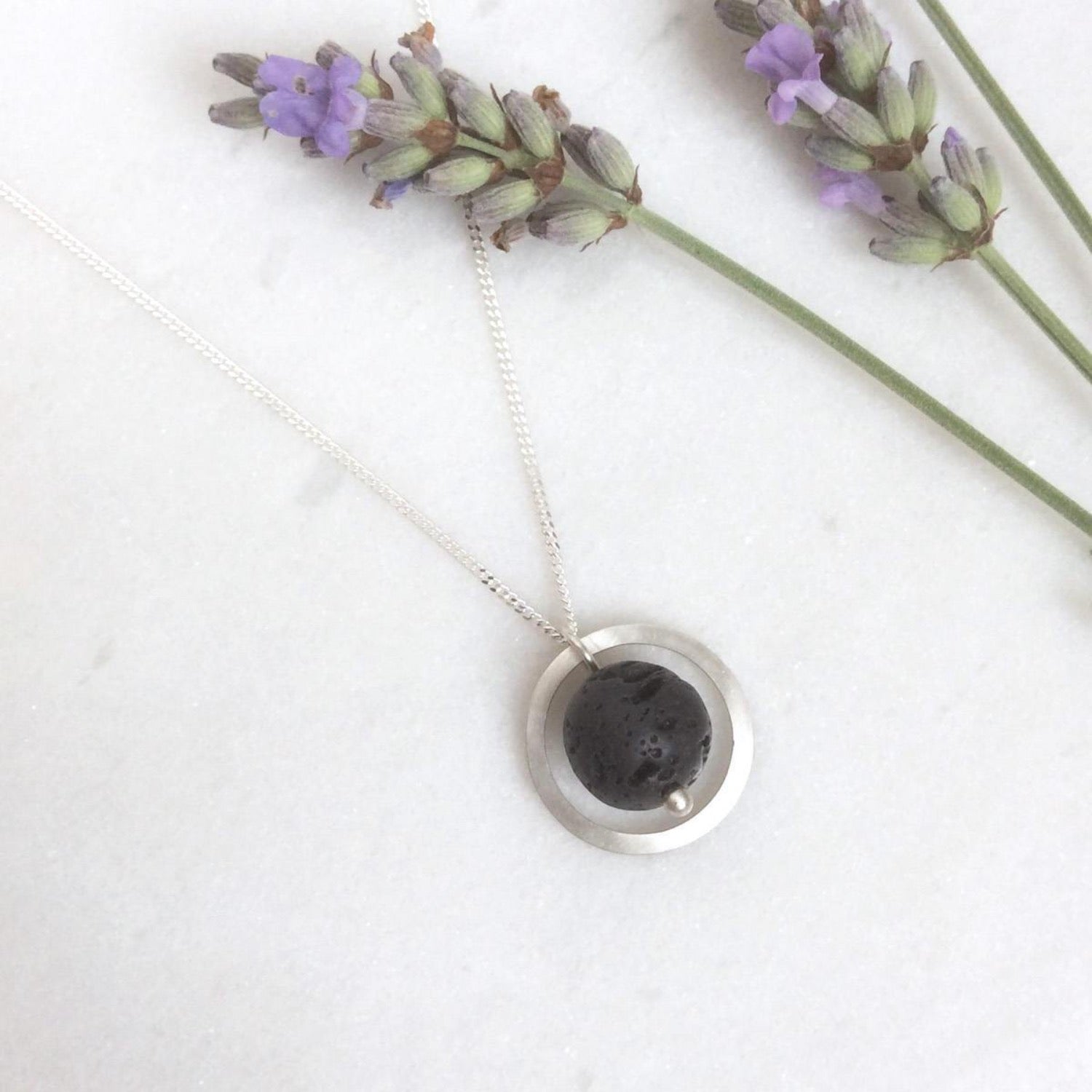 SILVER CIRCLE LAVA STONE DIFFUSER NECKLACE - Genevieve Broughton